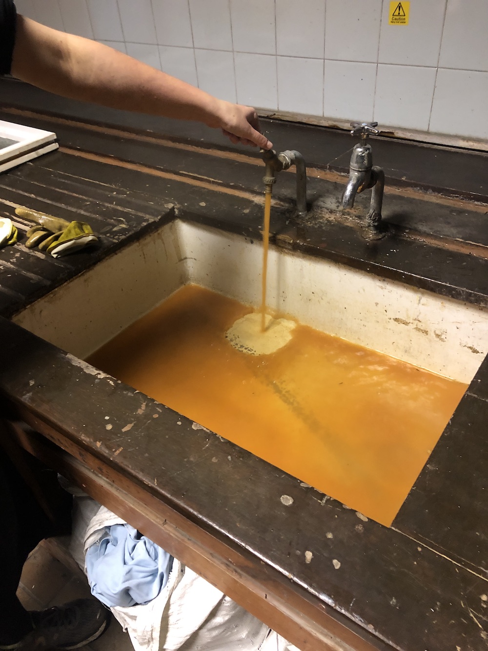 yellow water coming out of a tap