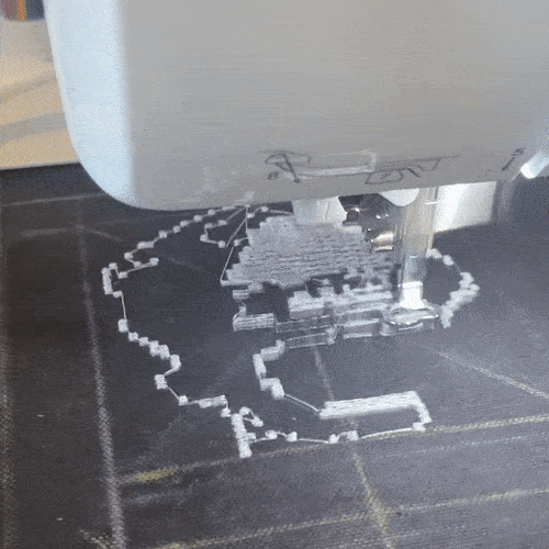 a gif of a machine embroidering