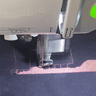 a gif of a machine embroidering a grid with a strange, snail-like toolpath
